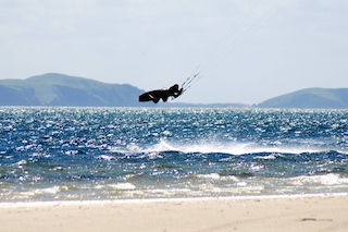 kitesurfer jumping at rangiputa
